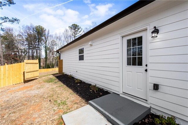 view of property exterior featuring fence