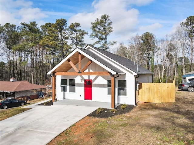 view of front of home featuring a shingled roof and board and batten siding