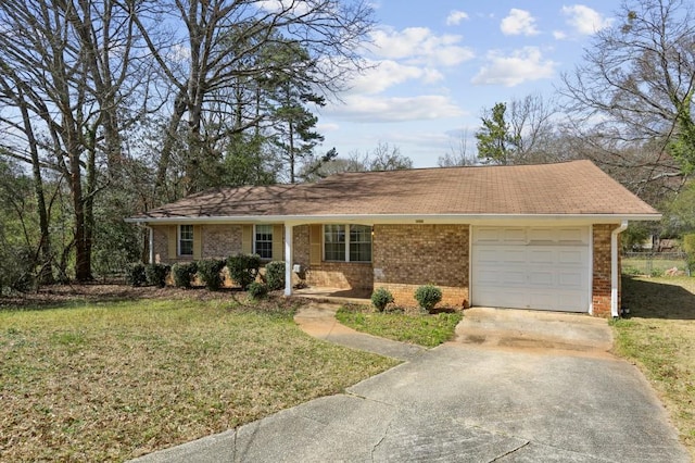 ranch-style house with brick siding, an attached garage, concrete driveway, and a front lawn