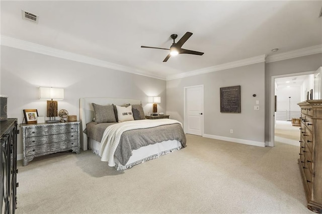 carpeted bedroom featuring crown molding and ceiling fan