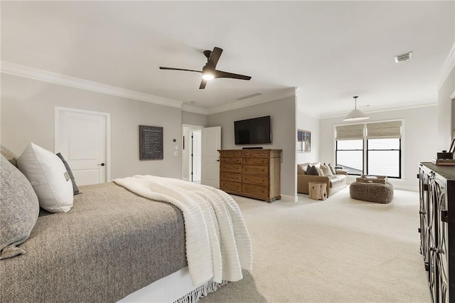 bedroom featuring crown molding, light carpet, and ceiling fan