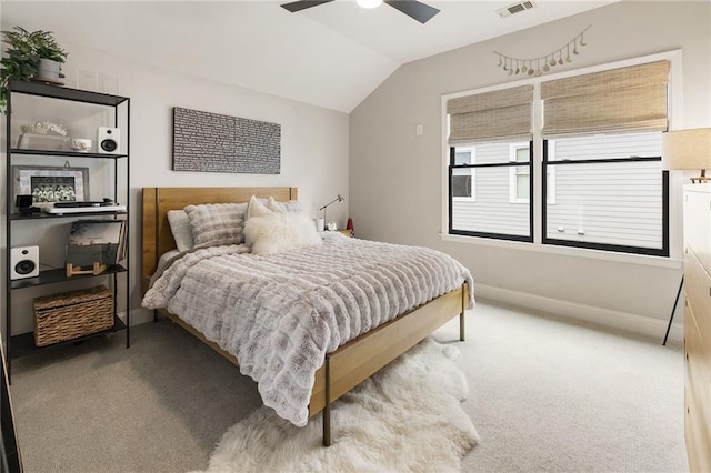 bedroom featuring ceiling fan, vaulted ceiling, and carpet