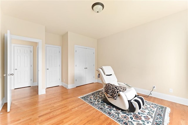 living area with hardwood / wood-style floors