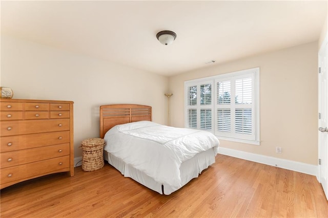 bedroom with hardwood / wood-style floors