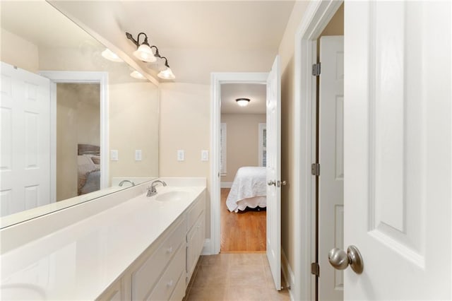 bathroom featuring tile patterned flooring and vanity