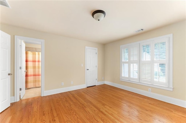 empty room with light wood-type flooring