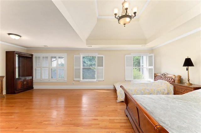 bedroom featuring vaulted ceiling, a notable chandelier, light wood-type flooring, and ornamental molding