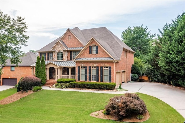 craftsman house with a garage and a front yard