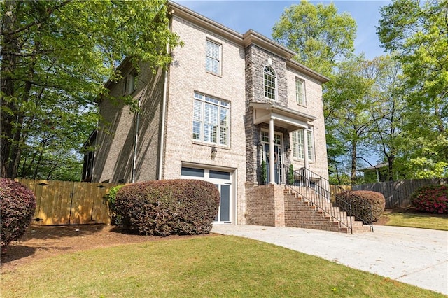 3110 Dickson St NE, Brookhaven, GA 30319 - view of front facade with an attached garage and brick siding