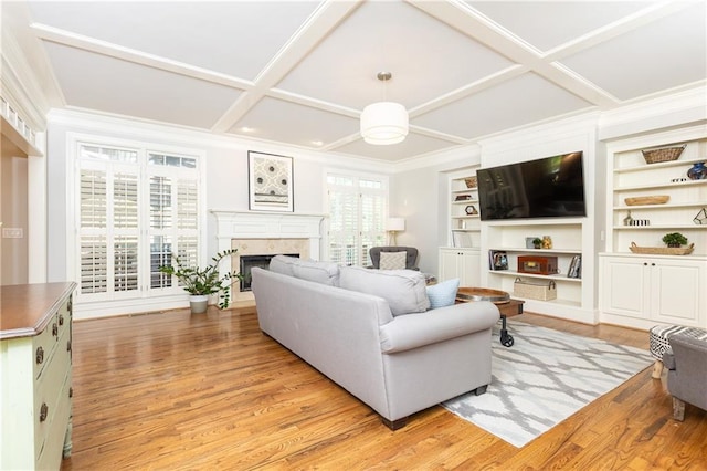 3110 Dickson St NE, Brookhaven, GA 30319 - living room with coffered ceiling, a fireplace, light wood-type flooring, built in features, and ornamental molding
