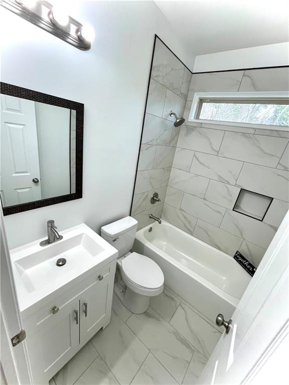 bathroom with toilet, marble finish floor, shower / tub combination, and vanity