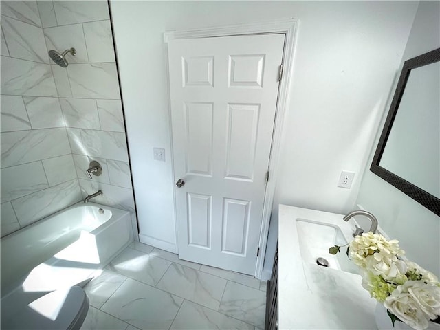 bathroom featuring marble finish floor, shower / bathtub combination, and vanity