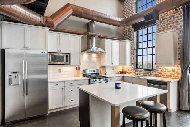 kitchen featuring white cabinetry, sink, a high ceiling, and appliances with stainless steel finishes