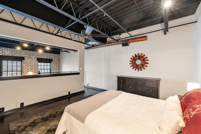 bedroom with brick wall and track lighting