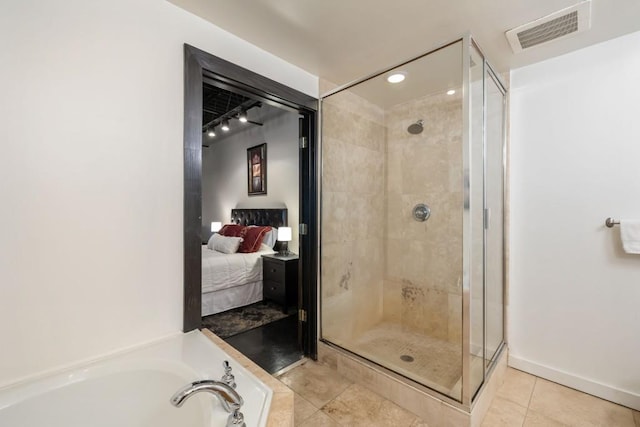 bathroom with plus walk in shower and tile patterned flooring