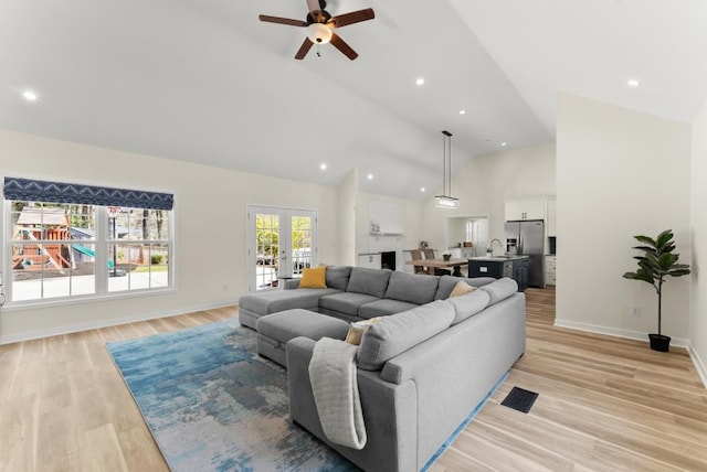385 Jayne Ellen Way, Alpharetta, GA 30009 - living area featuring ceiling fan, light wood finished floors, baseboards, high vaulted ceiling, and french doors