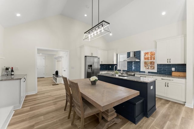 385 Jayne Ellen Way, Alpharetta, GA 30009 - kitchen with stainless steel fridge, wall chimney exhaust hood, a sink, white cabinetry, and recessed lighting