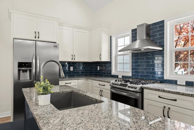 385 Jayne Ellen Way, Alpharetta, GA 30009 - kitchen with stainless steel appliances, wall chimney exhaust hood, a sink, white cabinetry, and light stone counters
