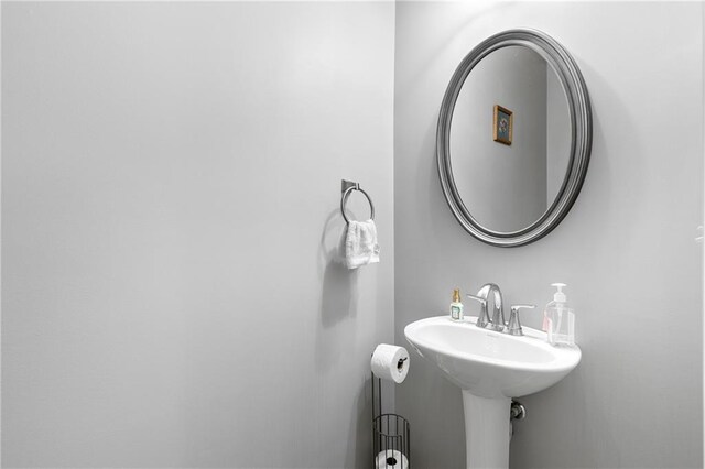 bathroom featuring walk in shower, vanity, and hardwood / wood-style flooring