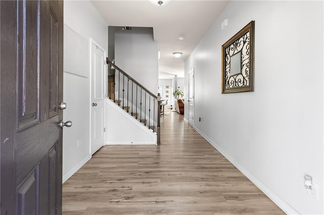 foyer with light hardwood / wood-style floors