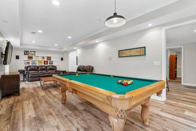 game room with billiards, baseboards, wood finished floors, a tray ceiling, and recessed lighting