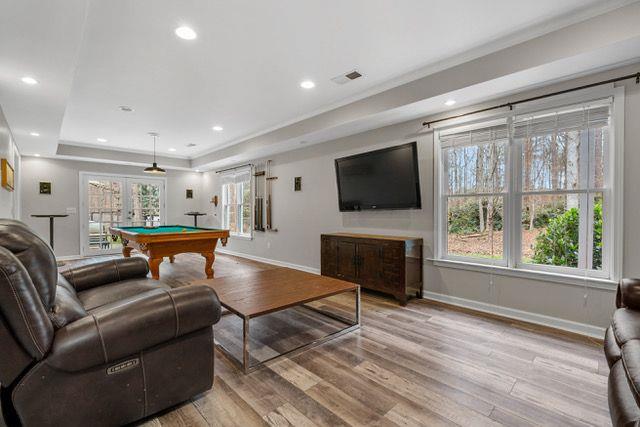 playroom with hardwood / wood-style floors, french doors, and pool table