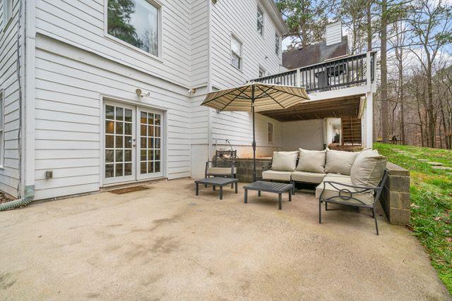 view of patio featuring french doors, a balcony, and an outdoor hangout area