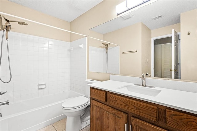 98 Hampshire Ct, Avondale Estates, GA 30002 - full bath with bathing tub / shower combination, toilet, vanity, tile patterned flooring, and a textured ceiling