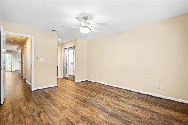 98 Hampshire Ct, Avondale Estates, GA 30002 - empty room with dark wood finished floors, a ceiling fan, and baseboards