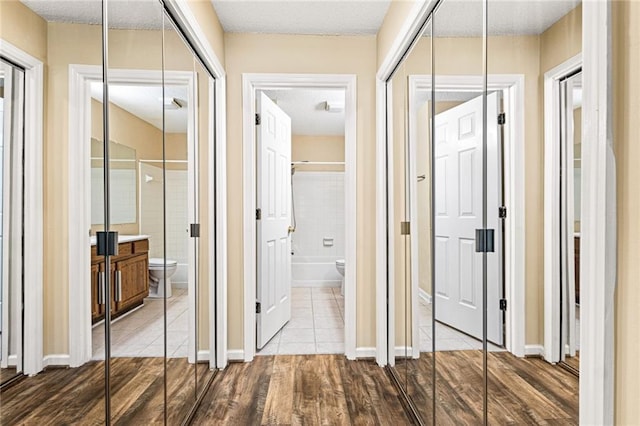 98 Hampshire Ct, Avondale Estates, GA 30002 - hall with dark wood-style floors, a textured ceiling, and baseboards