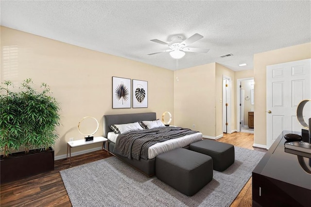 98 Hampshire Ct, Avondale Estates, GA 30002 - bedroom with wood finished floors, a textured ceiling, baseboards, and ceiling fan
