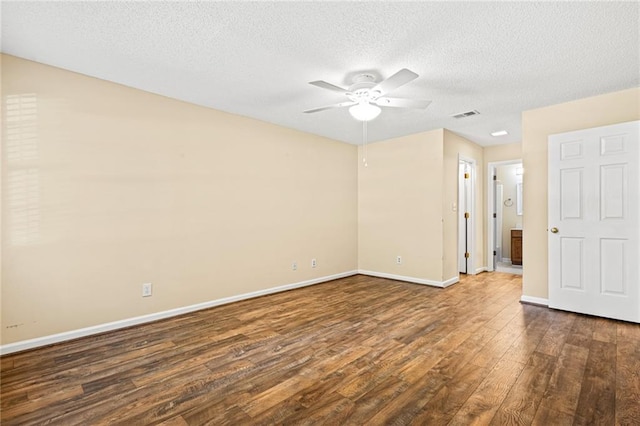 98 Hampshire Ct, Avondale Estates, GA 30002 - empty room with dark wood-style flooring, ceiling fan, a textured ceiling, and baseboards