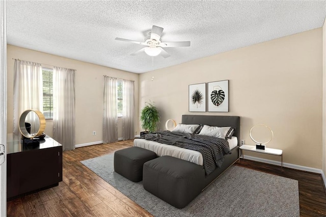98 Hampshire Ct, Avondale Estates, GA 30002 - bedroom featuring wood finished floors, baseboards, a textured ceiling, and a ceiling fan