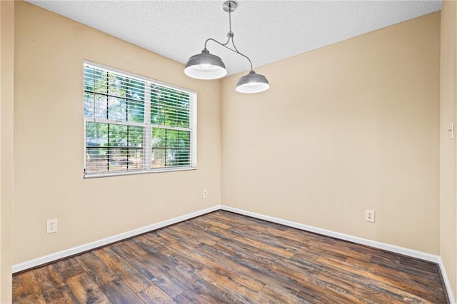 98 Hampshire Ct, Avondale Estates, GA 30002 - spare room featuring dark wood finished floors, baseboards, and a textured ceiling