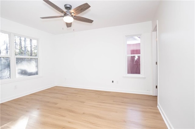 unfurnished room with ceiling fan and light hardwood / wood-style flooring