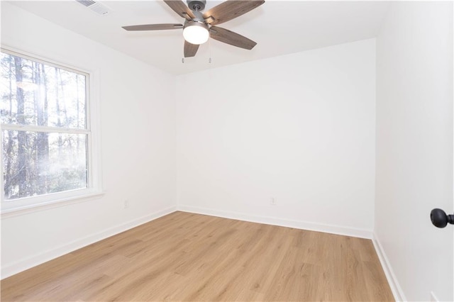 unfurnished room with light wood-type flooring and ceiling fan