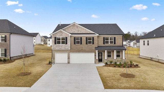 1029 Blue Juniper Cir, Loganville, GA 30052 - view of front of home with a garage, a front lawn, and covered porch