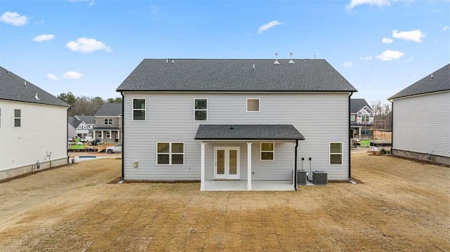 back of property featuring a yard and a patio area