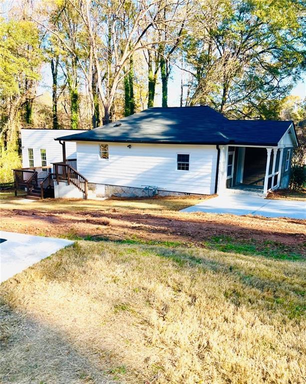 view of home's exterior with a yard