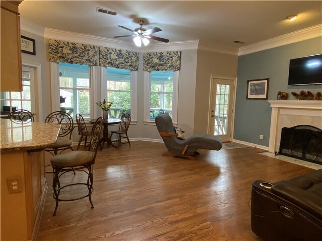 5440 Cameron Forest Pkwy, Johns Creek, GA 30022 - living area with wood finished floors, a ceiling fan, ornamental molding, and a high end fireplace