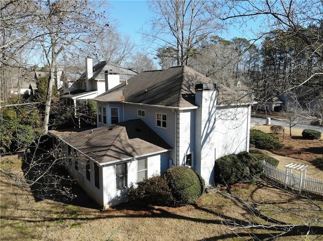 5440 Cameron Forest Pkwy, Johns Creek, GA 30022 - view of property exterior featuring a chimney and roof with shingles