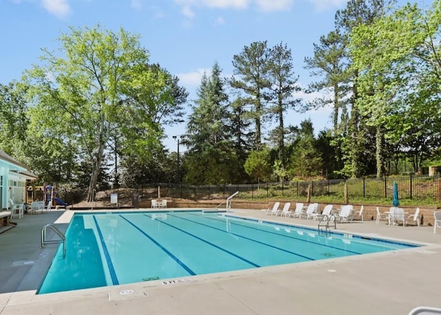 5440 Cameron Forest Pkwy, Johns Creek, GA 30022 - community pool with a patio area and view of wooded area