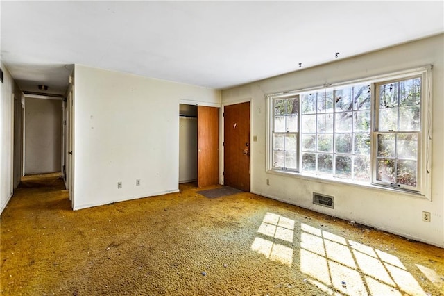 unfurnished bedroom with visible vents