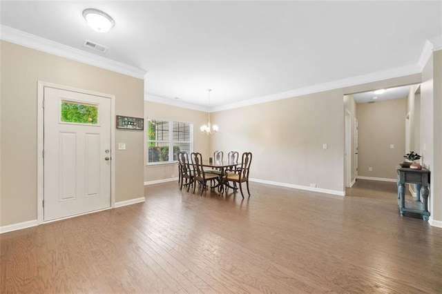 110 Collingwood Lndg, Covington, GA 30016 - dining space featuring wood finished floors, crown molding, and a chandelier