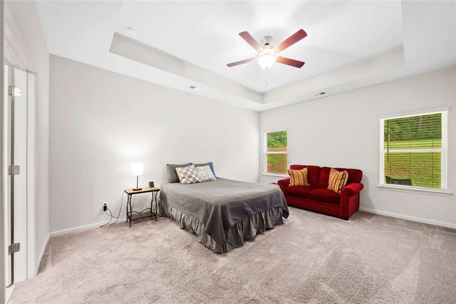 110 Collingwood Lndg, Covington, GA 30016 - carpeted bedroom featuring a raised ceiling and a ceiling fan