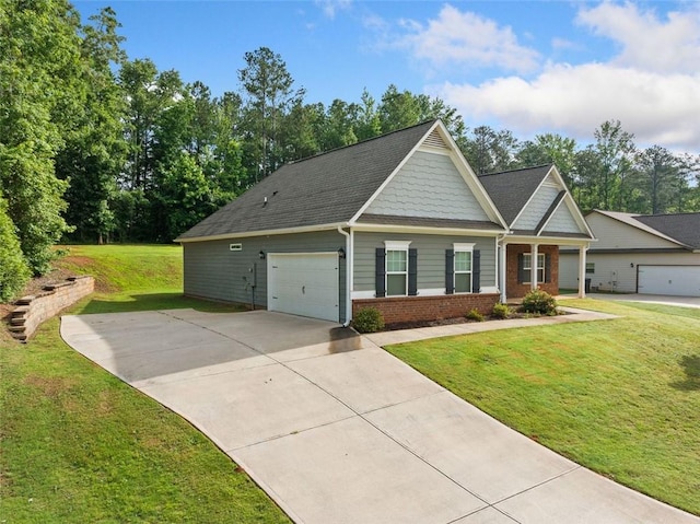 110 Collingwood Lndg, Covington, GA 30016 - craftsman house with driveway, brick siding, a front yard, and a garage