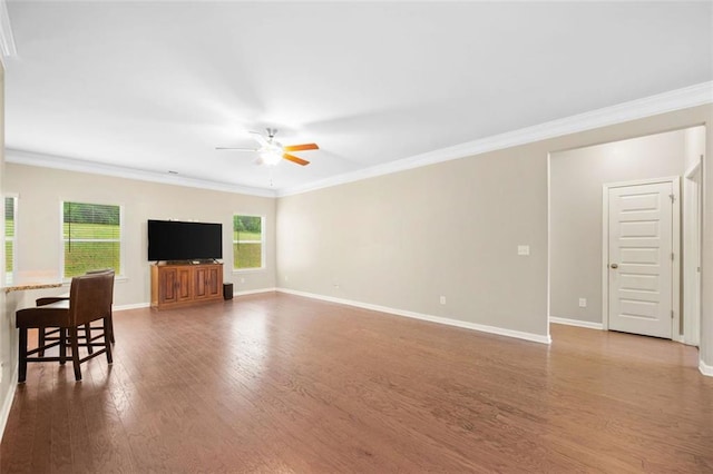 110 Collingwood Lndg, Covington, GA 30016 - living room featuring ceiling fan, wood finished floors, and crown molding