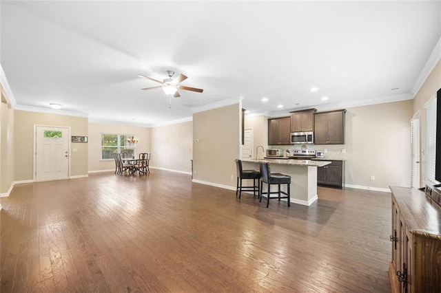 110 Collingwood Lndg, Covington, GA 30016 - living room with ceiling fan, ornamental molding, dark wood-style floors, and recessed lighting