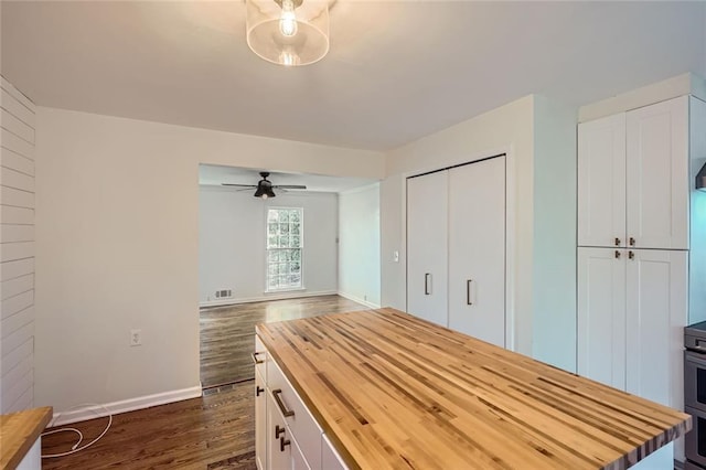 unfurnished bedroom featuring dark hardwood / wood-style flooring and a closet