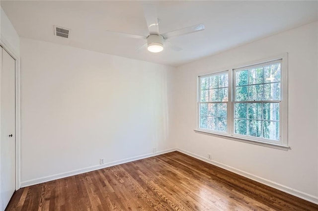 unfurnished room featuring hardwood / wood-style floors and ceiling fan